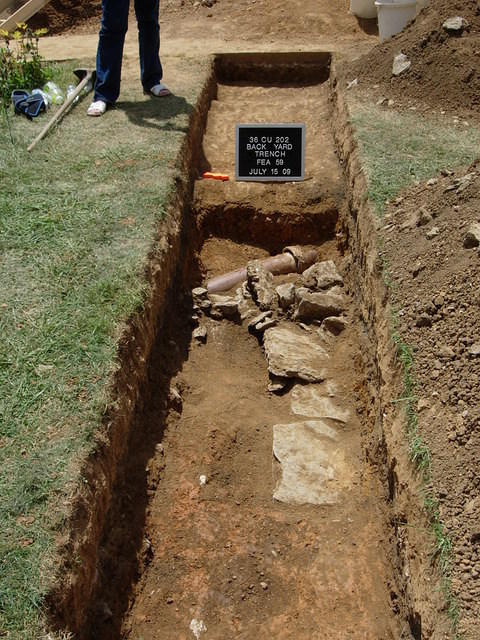 Back yard trench with old sewer pipe